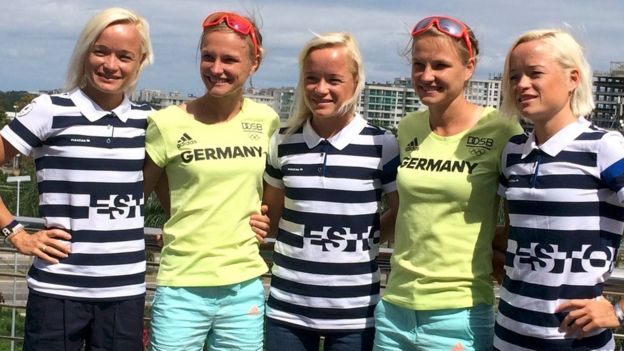 Marathon runners from Estonia, identical triplets (striped shirts L-R) Leila, Lily and Liina Luik, pose with runners from Germany, identical twins (yellow shirts L-R) Anna and Lisa Hahner