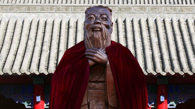 A statue of Confucius stands on display during a ceremony to mark his 2559th birth anniversary at the Changchun Confucian Temple