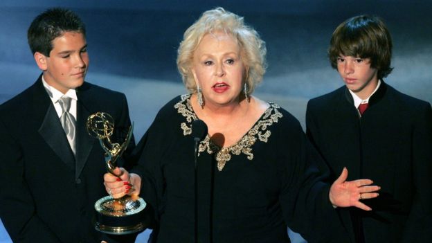Doris Roberts accepting an Emmy award alongside her grandsons