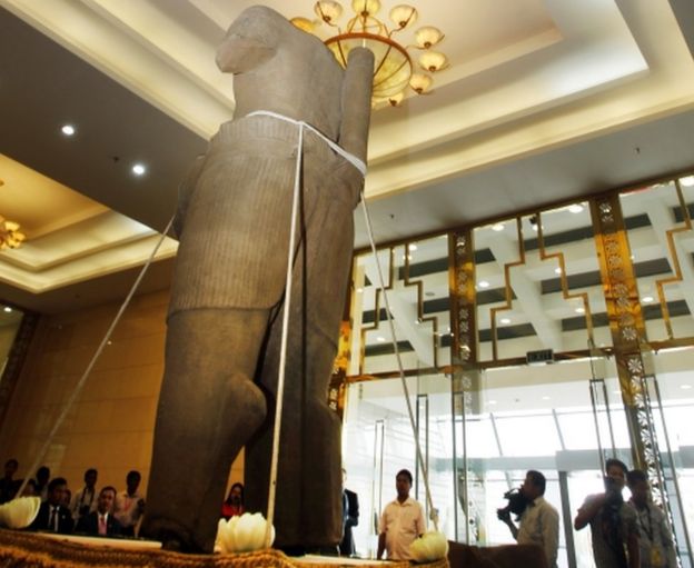 The Torso of Rama, a 10th century stone statue, is displayed during a handing over ceremony in Phnom Penh, Cambodia, Monday, 28 March 2016