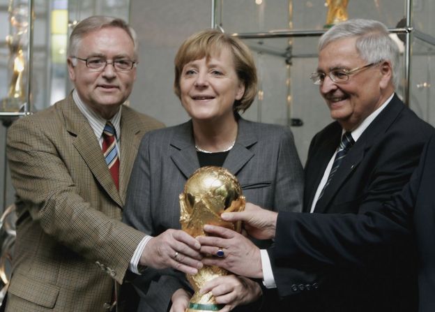 (L-R) Horst Schmidt, German Chancellor Angela Merkel and Theo Zwanziger at DFB headquarters in Frankfurt, 27 May 2006