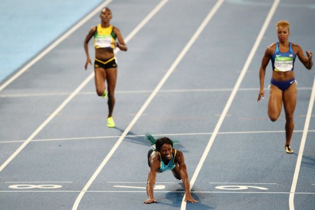 Shaunae Miller of the Bahamas dives over the finish line
