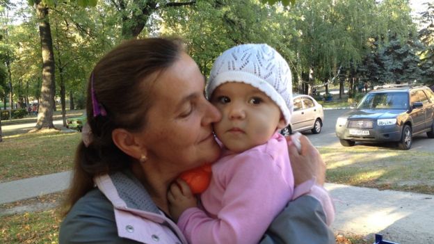 A Ukrainian mother hugs her baby, taken September 2015