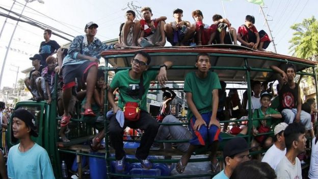Filipino villagers join a protest rally, a day after the national elections, in Muntinlupa city, south of Manila, Philippines, 10 May 2016