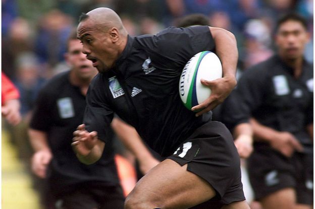 File picture of New Zealand's Jonah Lomu as he tucks the ball under his arm to run and score the All Blacks' first try against Tonga during their Rugby World Cup Group B match at Ashton Gate in Bristol, England, in this 3 October 1999 file photo