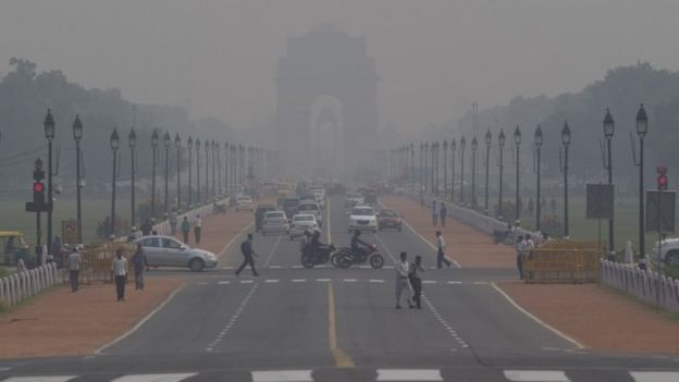 India Gate, one of the landmarks of central Delhi, is barely visible through thick smog in Delhi, India, Monday, Nov 9, 2015