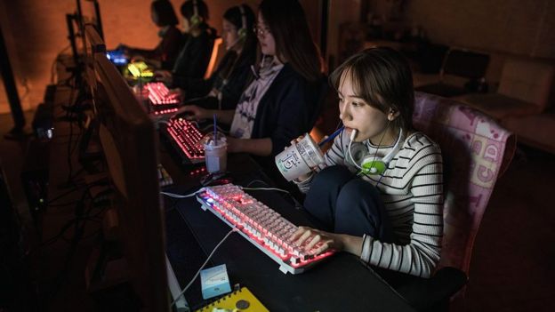 n a photo taken on April 8, 2016 Ji-Hee Lee (19) of the all-female computer gaming team 'QWER' sits at her computer at an office used as a training venue for their team,