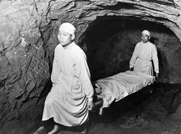 1938: Stretcher bearers at work in the shelters below Chongqing