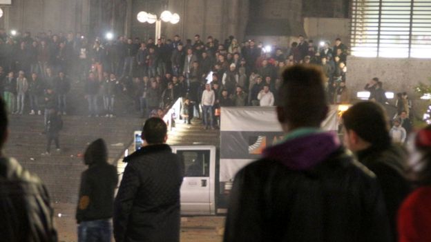 Young men gather outside Cologne's main station on 31 December