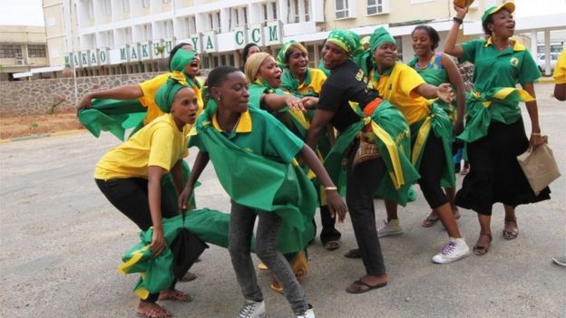 Supporters of the ruling CCM party celebrates at the party's headquarters in Dodoma, Tanzania, after the party's presidential candidate, Dr. John Pombe Magufuli was declared a winner, Thursday Oct. 29, 2015