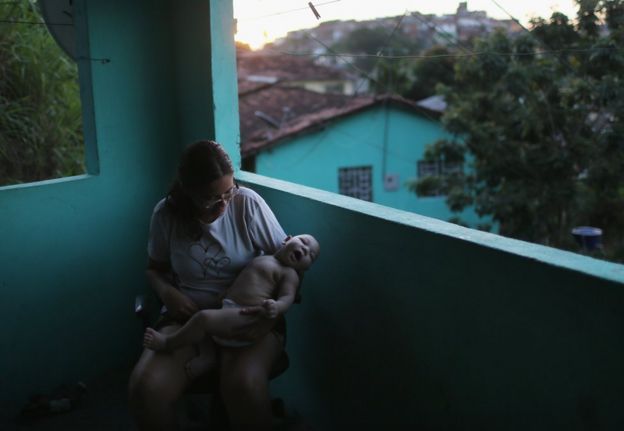 Woman in Recife, Brazil holding a child who was born with microcephaly
