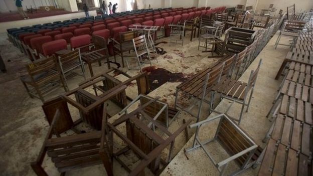 Upturned chairs and blood stains the floor at the Army Public School auditorium the day after Taliban gunmen stormed the school in Peshawar - 17 December 2014