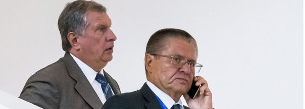 Rosneft CEO Igor Sechin (L) and Economy Minister Alexei Ulyukayev attending a meeting in Baku, Azerbaijan in August