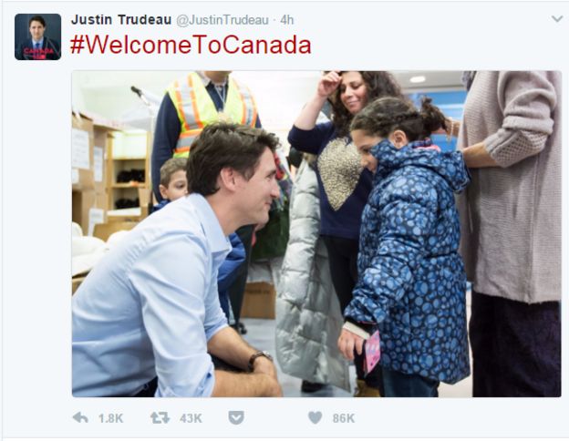 Screenshot from the account of Candian PM Justin Trudea, showing a photo of him greeting a Syrian refugee girl in 2015, with the caption: #WelcomeToCanada
