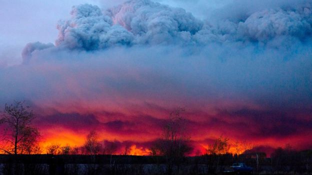 A wildfire moves towards the town of Anzac from Fort McMurray, Alberta., on Wednesday May 4, 2016