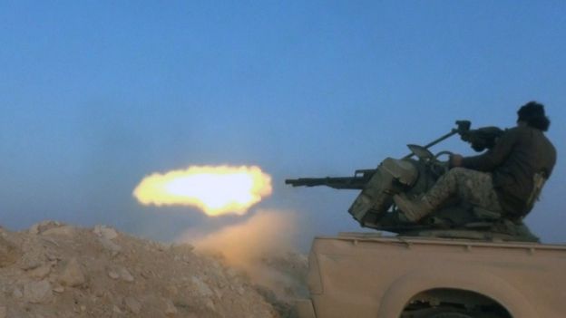 Islamic State militant fires a machine-gun near Mahin, Syria (1 November 2015)