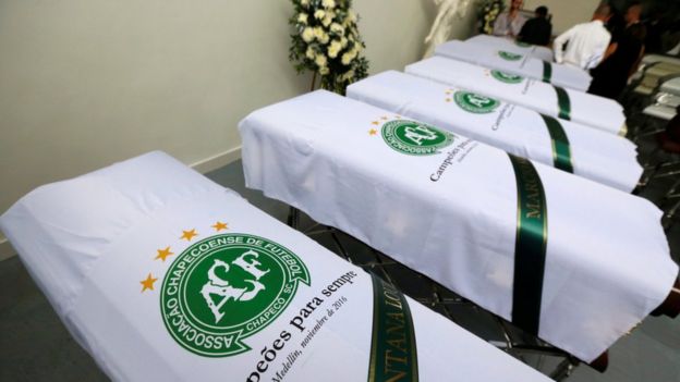 Blankets bearing the crest of Brazilian soccer team Chapecoense are placed on coffins in Medellin, Colombia December 1, 2016.