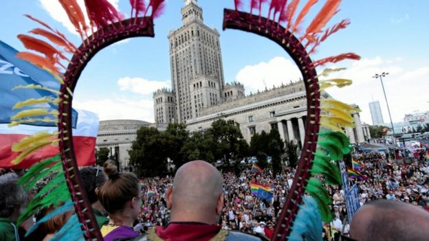 People take part in the annual Equality Parade in front of the Palace of Culture and Science in Warsaw, 11 June 2016