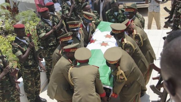 Army officers carry the casket of Lt Gen Adolphe Nshimirimana during his funeral in Bujumbura, Burundi - Saturday 22 August 2015