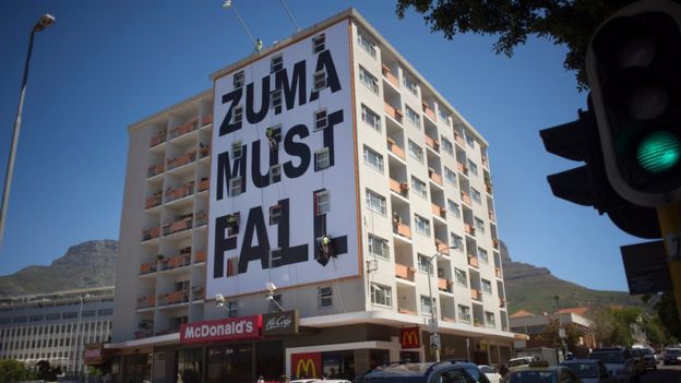 Zuma Must Fall banner hangs from building
