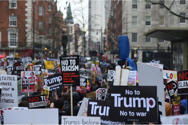 Demonstrators gather at the US Embassy in central London, ahead of a protest and march to Downing Street, against US President Donald Trump's travel ban, 4 February