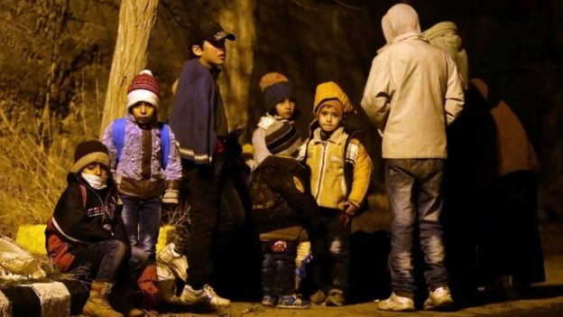 Syrian children wait on the outskirts of after being evacuated from the town. Photo: 11 January 2016