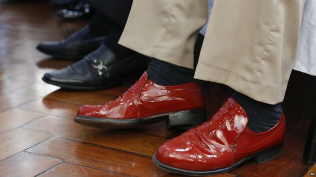 A contestants shiny red shoes at Sao Paulo's 