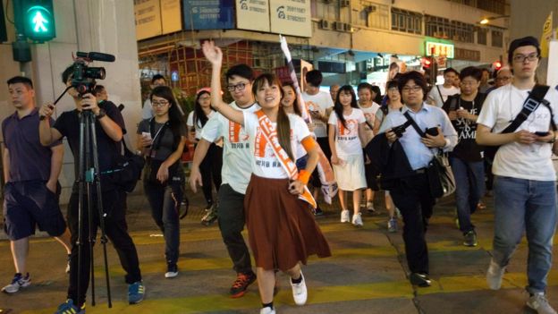 Yau Wai-ching (C) of the Youngspiration political party canvasses for votes in the Kowloon West Geographical Constituency on voting day in the Hong Kong Legislative Council elections 2016