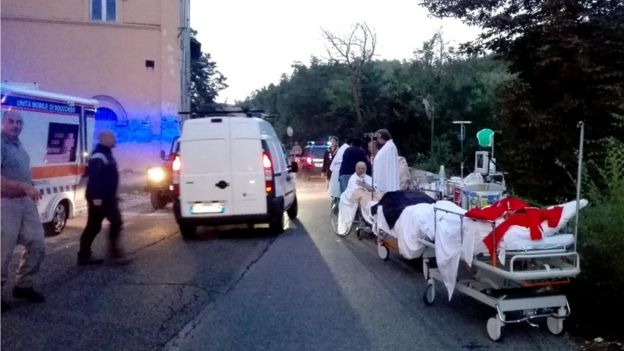 First aid is provided to people who were injured in an earthquake at a hospital in Amatrice