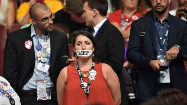 A supporter of former Democratic presidential candidate Bernie Sanders stands in silent protest during Day 1 of the Democratic National Convention