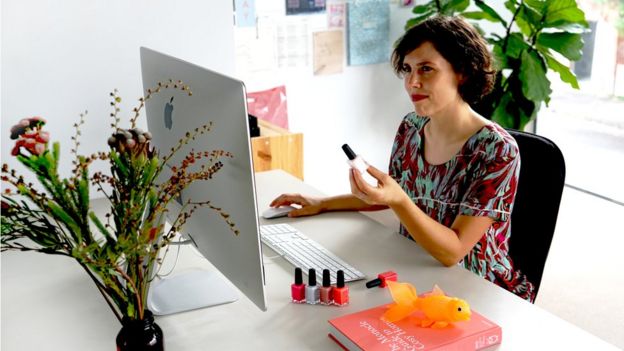 Anna Ross at her desk