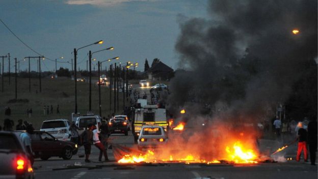 Residents create a roadblock as they take part in a protest over poor public service delivery in Bronkhorstspruit on February 5, 2014