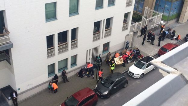 People being treated by medics at Maalbeek metro station