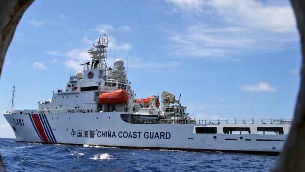 In this 29 March 2014 file photo, a Chinese Coast Guard ship attempts to block a Philippine government vessel as the latter tries to enter the Second Thomas Shoal in the South China Sea to relieve Philippine troops and resupply provisions.