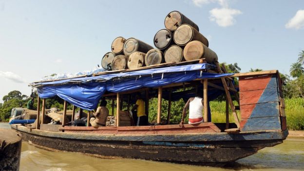 Illegal oil is ferried to market in the Niger Delta in April 2013