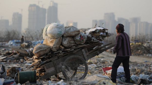 A man collects rubbish from a construction site in Hefei, central China's Anhui province