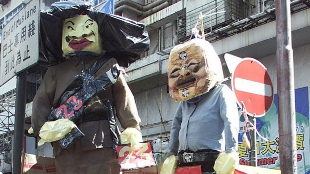 Effigies of Ms Ip and Chief Executive Tung Chee-hwa during the 1 July 2003 protest