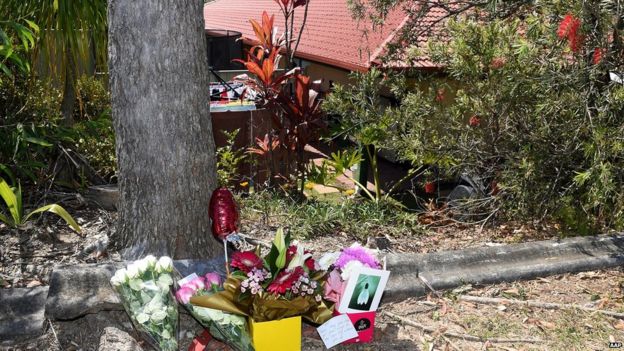 Flowers are left outside a residence in Molendinar on the Gold Coast, Thursday, Sept. 10, 2015. New Zealand woman Tara Brown, 24, died in hospital late Wednesday night after she was allegedly beaten by her estranged partner Lionel Patea.