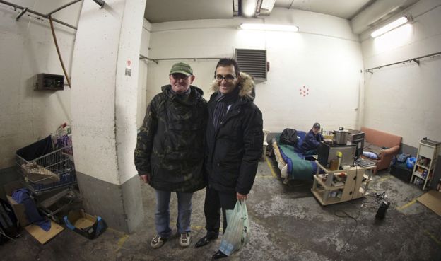 Arash Derambarsh with a homeless Polish man in Courbevoie, Paris