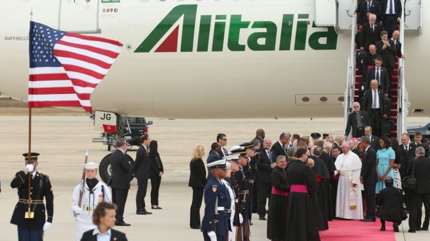 Pope Francis shakes hands with Vice President Joe Biden along with U.S. President Barack Obama, first lady Michelle Obama, and other political and Catholic church leaders after arriving from Cuba September 22, 2015 at Joint Base Andrews, Maryland.