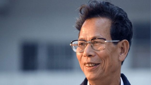 In this Saturday, March 3, 2012 file photo, Lin Zuluan smiles after he was elected as chief of village in an election to select village committees in Wukan village, Lufeng city, in southern China