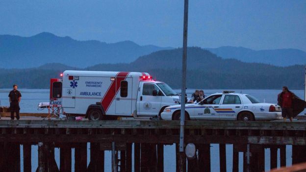 Rescue personnel mounting a search for victims of a capsized whale watching boat park on a wharf in Tofino, British Columbia October 25, 2015.