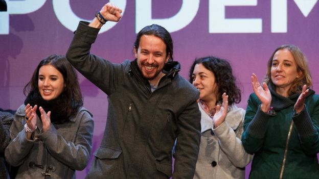 Podemos (We Can) leader Pablo Iglesias (2L) acknowledges his supporters after learning the final general elections results