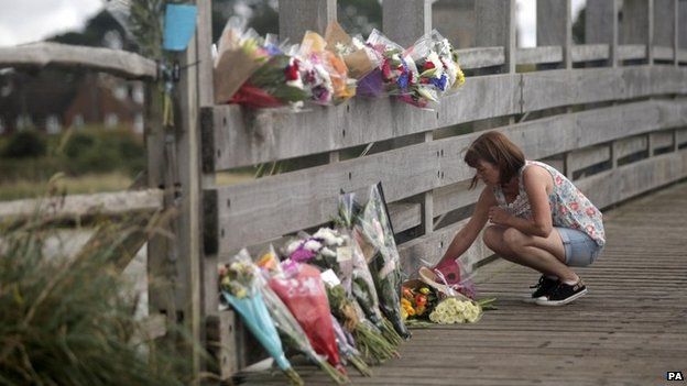 Flowers laid on the Shoreham toll bridge near the plane crash site