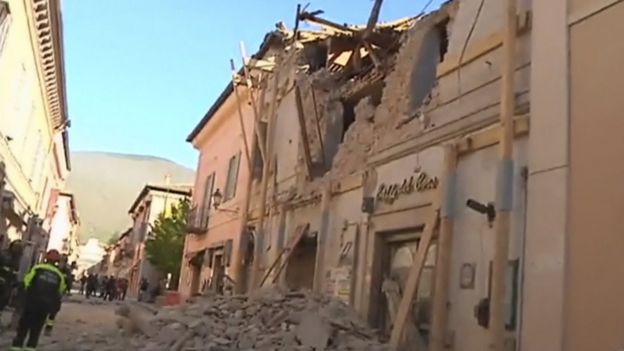 Firefighters attend a damaged building in Norcia, Italy, following an earthquake on Sunday, 30 October 2016