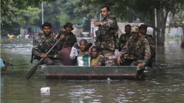 Indian army soldiers rescue flood affected people in Chennai, India, Thursday, Dec. 3, 2015.