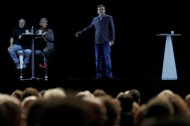 The hologram of Jean-Luc Melenchon speaks to supporters in Saint-Denis, near Paris, 5 February