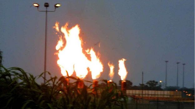 A view of the gas flames at Mobil oil terminal 30 May 2002, at Ibeno, southern Nigeria.