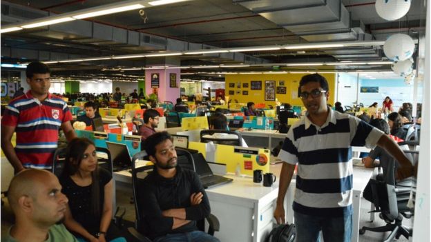 A meeting of young people in a colourful InMobi office