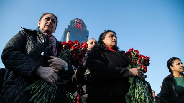 People visit the scene of Saturday's blasts on 11 December 2016 in Istanbul, Turkey.
